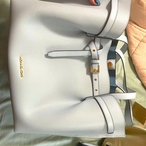 Brand new Michael Kors large purse. Tags attached. Never used